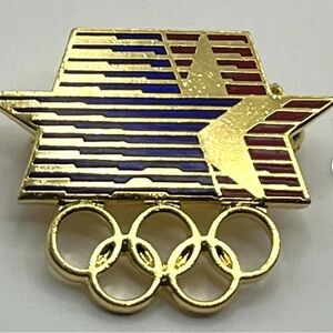 1984 Los Angeles Olympic Summer Games With Stars In Motion Logo And 5 Rings Pin.